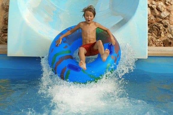 kid on water slide